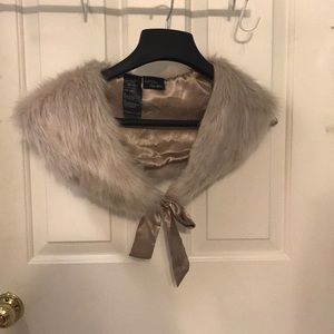 Cream colored, faux fur stole.